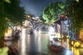 Wuzhen water town tourist boats, bridge and buildings night view china Royalty Free Stock Photo