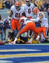 WVU football player stretches trying for a TD