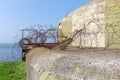 WW2 concrete shelter with barbwire near Kornwerderzand at Dutch Afsluitdijk