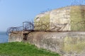 WW2 concrete shelter with barbwire near Kornwerderzand at Dutch Afsluitdijk