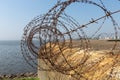 WW2 concrete shelter with barbwire near Kornwerderzand at Dutch Afsluitdijk