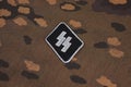 WW2 German Waffen-SS military insignia on SS camouflage uniform Royalty Free Stock Photo