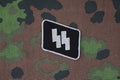 WW2 German Waffen-SS military insignia on SS camouflage uniform Royalty Free Stock Photo