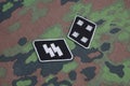 WW2 German Waffen-SS military insignia on SS camouflage uniform Royalty Free Stock Photo