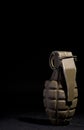 WW2 hand grenade against a black background. Royalty Free Stock Photo