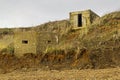 WW2 sea defences slipping down the cliff side due to coastal erosion on the suffolk coastline. Royalty Free Stock Photo