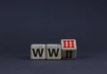 WW3 world war 3 symbol. Turned the wooden cube and changed the concept word WW2 to WW3. Beautiful grey table grey background, copy
