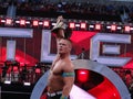 WWE Wrestler John Cena holds up USA Championship title