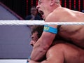 WWE Wrestler John Cena puts Rusev in The STF, short for Stepover Toehold Facelock, during wrestling match Royalty Free Stock Photo
