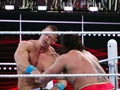 WWE Wrestler John Cena takes punch in face from Rusev during wrestling match Royalty Free Stock Photo