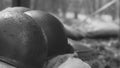 WWII American Metal Helmets Of United States Army Infantry Soldier At World War II. Helmets Near Camping Tent In Forest