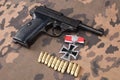 WWII era nazi german army 9 mm semi-automatic pistol with Iron Cross award Royalty Free Stock Photo