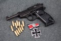 WWII era nazi german army 9 mm semi-automatic pistol with Iron Cross award Royalty Free Stock Photo