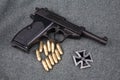 WWII era nazi german army 9 mm semi-automatic pistol with Iron Cross award Royalty Free Stock Photo