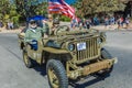 - WWII jeep with flag in parade