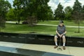 WWII US Navy veteran reminisces at a monument about his time on the aircraft carrier Yorktown during WWII Royalty Free Stock Photo