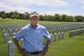 WWII veteran standing in cemetery