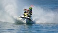 Jet Ski cornering at speed creating at lot of spray. Royalty Free Stock Photo