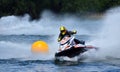 Jet Ski  race competitor cornering at speed creating at lot of spray. Royalty Free Stock Photo