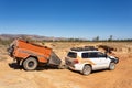 Wyndham, WA, Australia - Aug 31, 2014: A Toyota Landcruiser and Camprite offroad camper trailer negotiate a washed out creek on