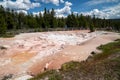 Wyoming, USA - July 1, 2020: Tourists watch the fountain paint pots and mud pots in Yellowstone National Park Royalty Free Stock Photo