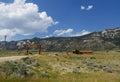 Wide shot of the mountainside with the gate and structures of Canyon Lake Estates along North Fork Royalty Free Stock Photo