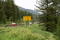 Sign warning drivers of Teton Pass, a steep mountain road with 10% grades, will close for snowstorms Royalty Free Stock Photo