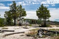 Tourists view a hot spring geyser in the Biscuit Basin area of Yellowstone National Park Royalty Free Stock Photo