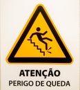 "atenÃ§Ã£o, perigo de queda" sign.  Triangular shape with person falling from steps on yellow background. Royalty Free Stock Photo