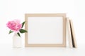 Gold landscape frame mockup with flowers and books