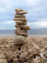 & x22;Cairn& x22; pile of stone. The art of arrange stones vertically