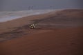 4x4 car against scenic beach background in Namibe desert dunes