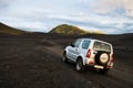 A 4x4 car in off-road route through the inland of Iceland through gravel and stone roads through spectacular landscapes