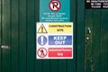 A "Construction Site, Keep Out and Authorised Persons only" phrase on a sign  on a green wooden wall Royalty Free Stock Photo