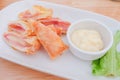 & x22; Deep fried spring roll with ham cheese & x22; serve on dish with salad sauce , Thailand. Royalty Free Stock Photo