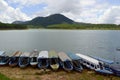 Mountain hill and ferry boats for boat trips on the lake