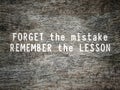 'Forget the mistake remember the lesson' text background. Inspirational and motivational quote concept. Stock photo. Royalty Free Stock Photo