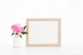 8x10 gold frame mockup on a white backlit background. Pink Peony in white vase, minimalist mock up