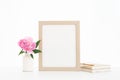 8x10 gold frame mockup on a white backlit background. Pink Peony in white vase with boho books