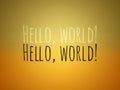 "Hello World" Writing on Colorful Yellow Wallpaper with Inner Bright Light and Darker Outers Royalty Free Stock Photo