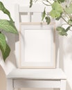 Portrait wooden frame mockup with house plants and chair.