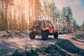 4x4 jeep SUV car is driving fast on a dusty road in the forest in a summer race Royalty Free Stock Photo