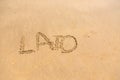 'Lato' word written on sand