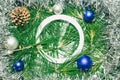 X-mas with silver decoration, Christmas balls, pinecones and green pine leaves. Empty circle copy space for text Royalty Free Stock Photo