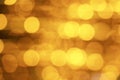 X-mas pattern.. Blurred gold sparkles background. Yellow golden glittering christmas lights. Blurred abstract backdrop. Golden Royalty Free Stock Photo