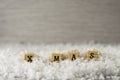 X mas word made of letters on wooden cubes on a snow background 4 Royalty Free Stock Photo