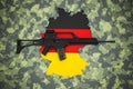 German 5.56 x 45mm assault rifleon camouflage background