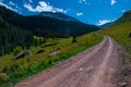 4x4 Off Road Vehicle dirt road heading up the Mountains Royalty Free Stock Photo