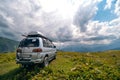 4x4 offroad old van without identification marks on mountain valley. Off-road travel, journey in motorhome concept. Oveland,