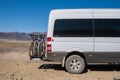 4x4 offroad van with hitch bike rack installed on the back. Off-road camper with bicycle rack. Travel, tourism concept Royalty Free Stock Photo